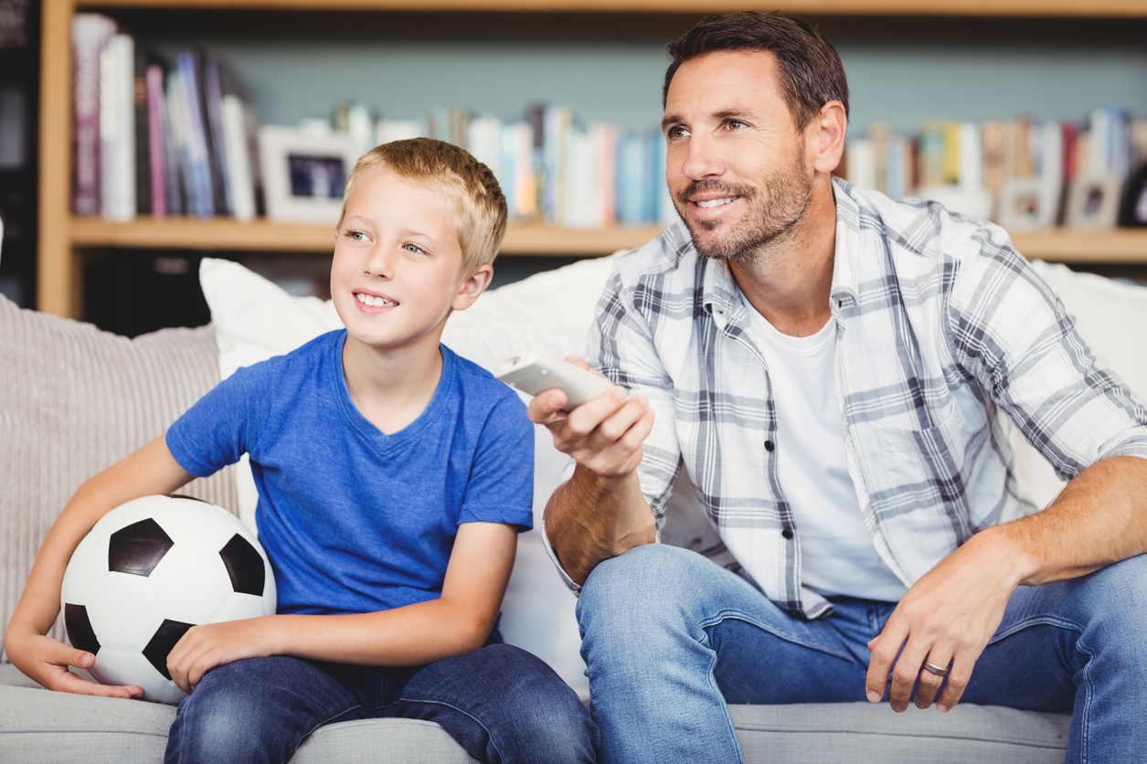 Smiling Father And Son Watching Football Match Space Storage Dublin Space Storage Dublin