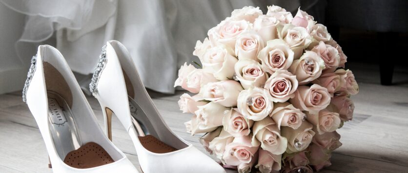 wedding dress shoes and boquet
